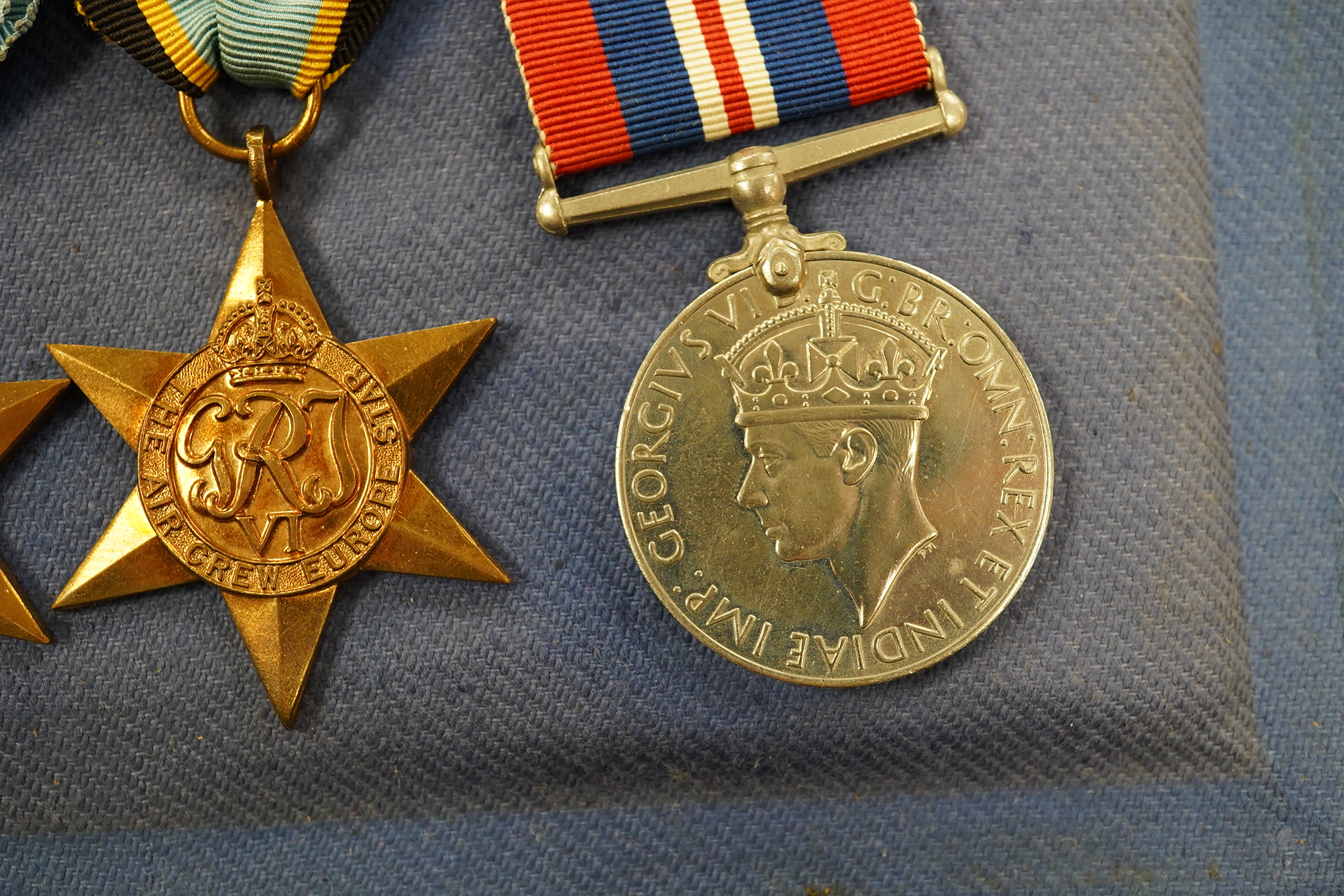 A DFC medal group with an Air Crew Europe star in a display case. Condition - good